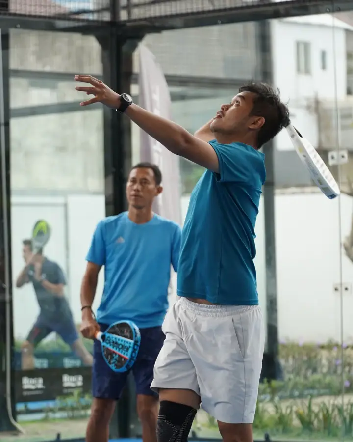 A player hitting an overhead