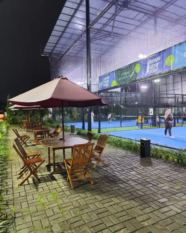 Terrace with umbrellas by the courts